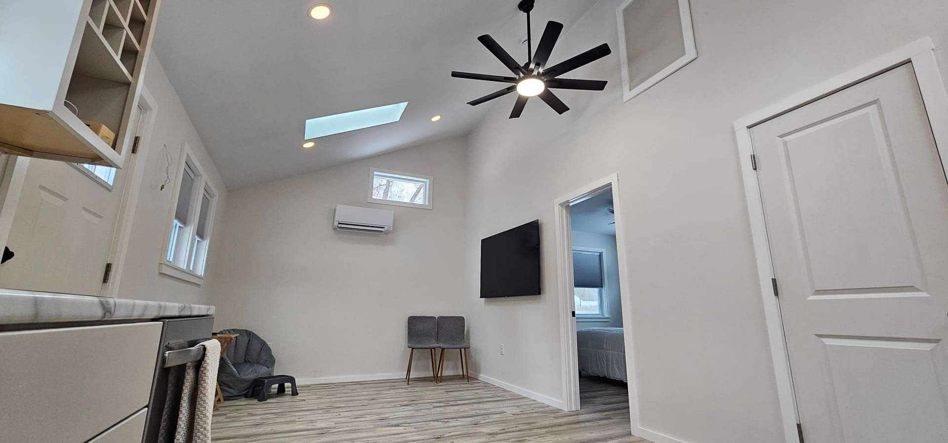 ADU living area — vaulted ceiling and TV wall