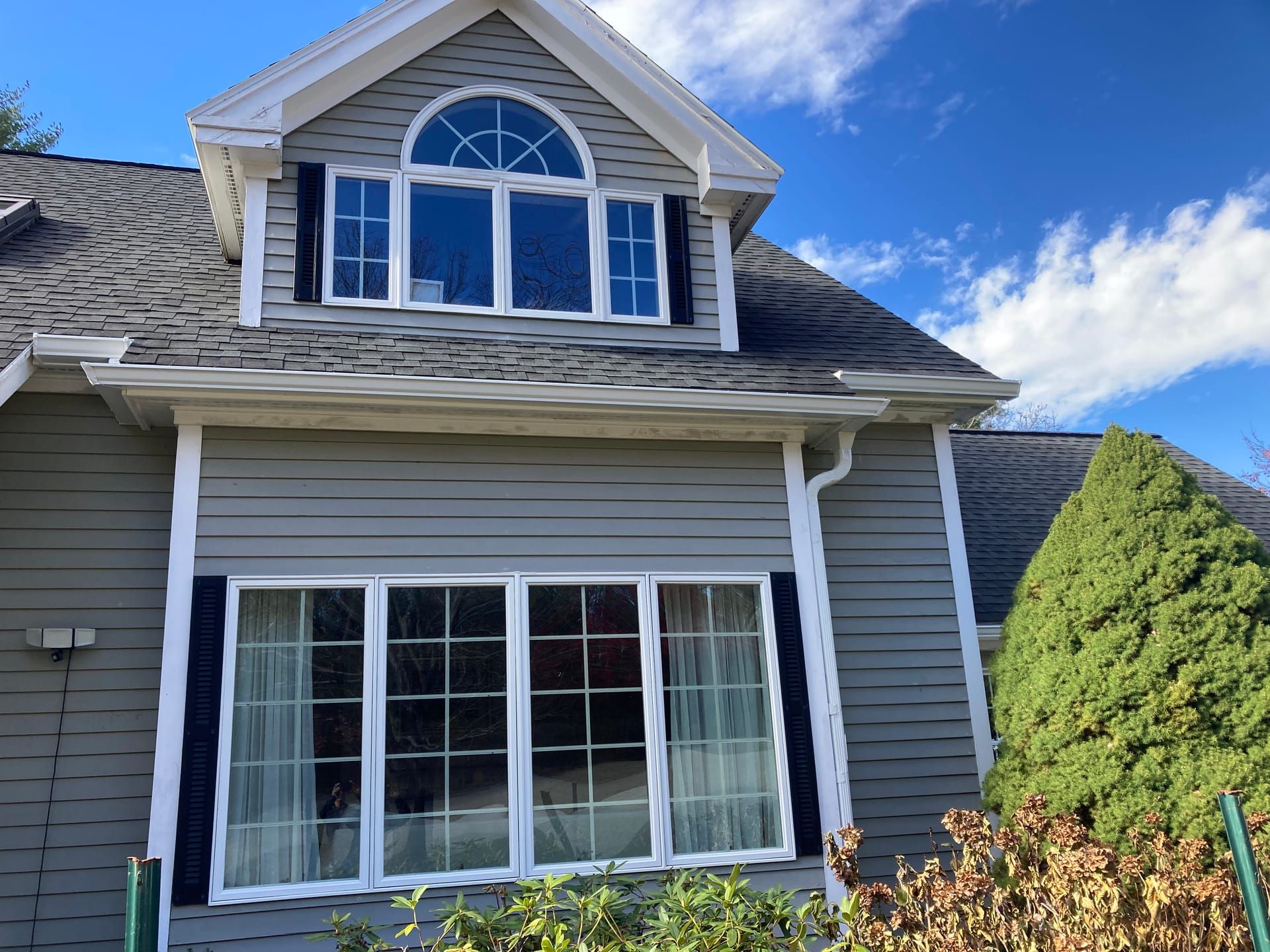 Home exterior with arch window