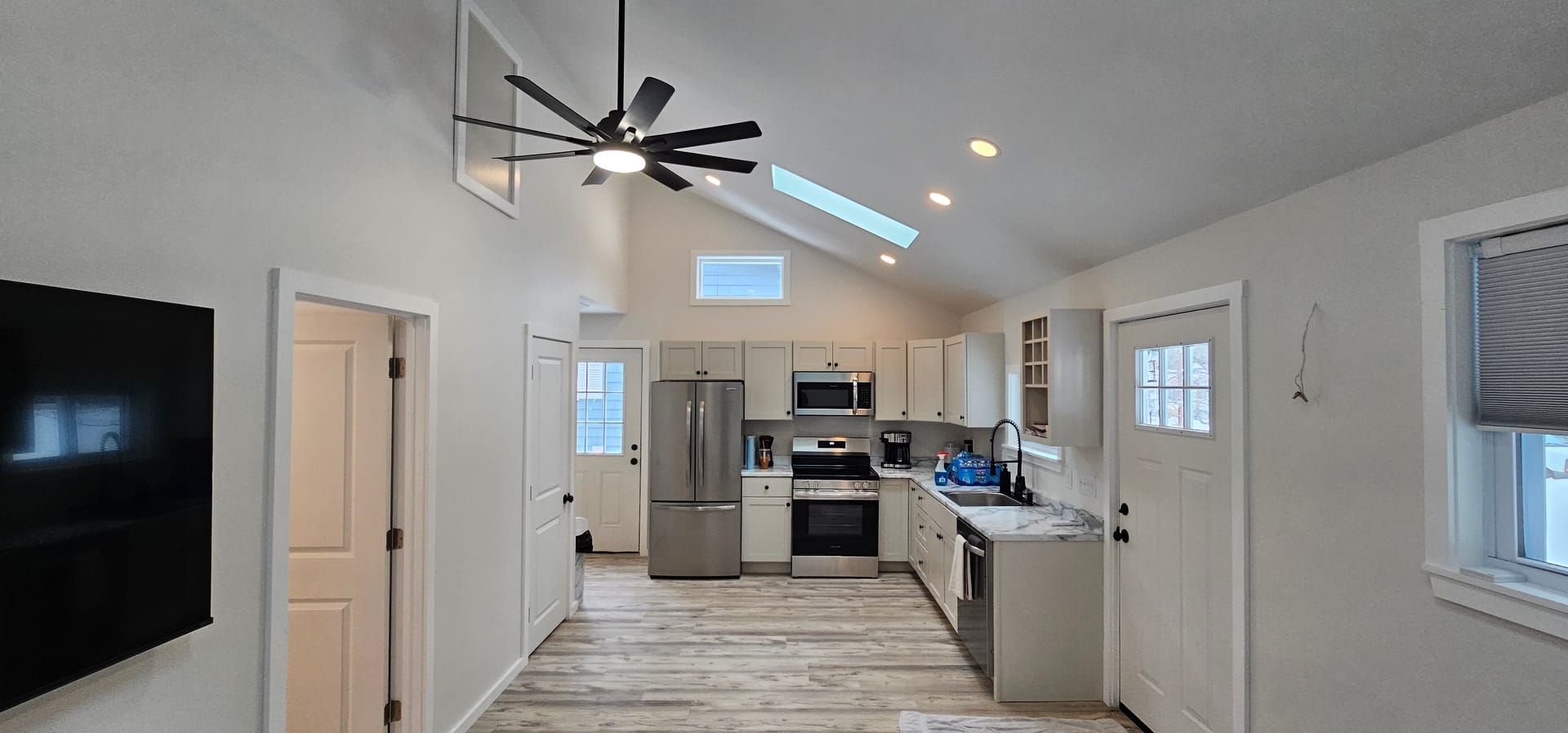 ADU kitchen with vaulted ceiling and modern finishes