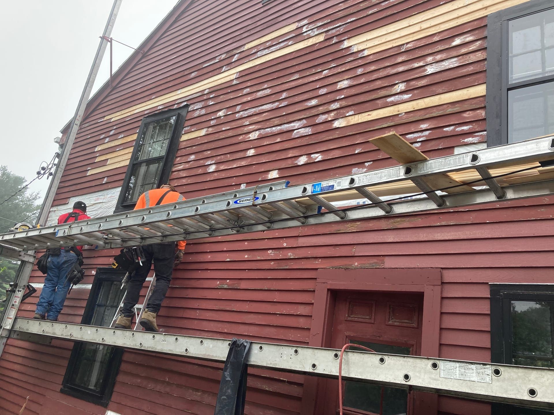 Siding repair on historic colonial